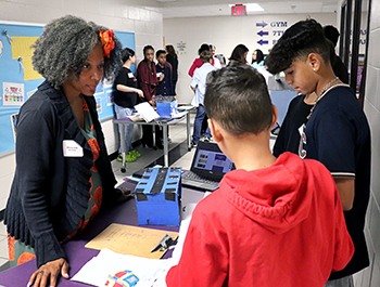 Students at Coleman Middle School presenting their Project/Problem Based Learning projects to Dr. Tarece Johnson-Morgan